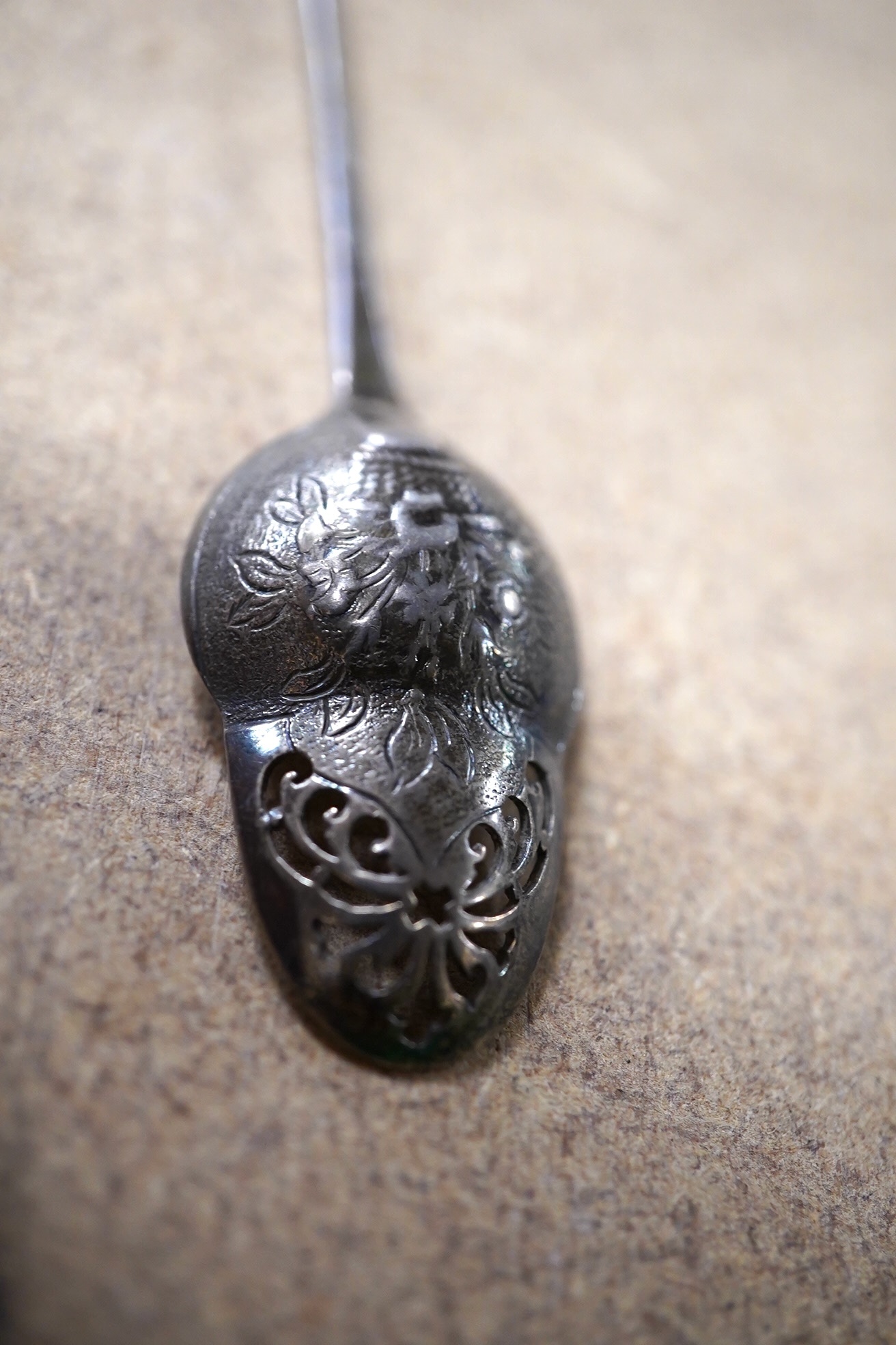 A George II silver mote spoon with acorn shaped picture back bowl, maker's mark for Elizabeth Oliver, circa 1755, 13.6cm. Condition - fair